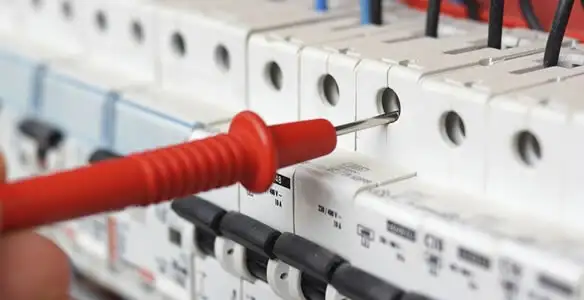 Electrical contractor testing circuit breakers during electrical repair in Ferndale, MI