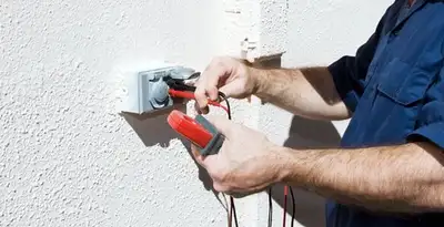 Electrician performing home electrical outlet and wiring inspection in Detroit, MI