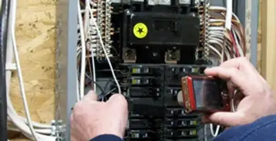 Home electrical inspection of circuit breaker panel by licensed electrician in Detroit, MI