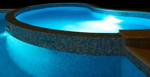 pool light installation and repair services highlighting illuminated pool interior lighting in Detroit, MI