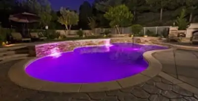 pool light installation and repair services illuminating a residential swimming pool in Detroit, MI