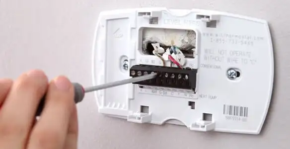 Thermostat installation service with proper wiring and secure wall mounting in Detroit, MI