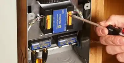 Whole home surge protection device being installed by a licensed electrician to protect electrical systems in Detroit, MI